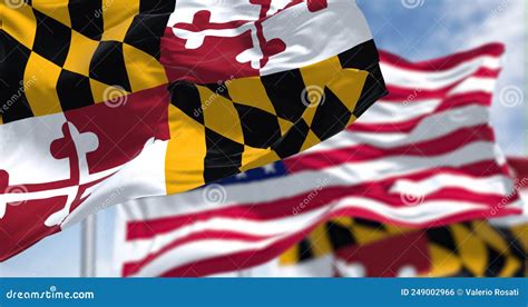 The Maryland State Flag Waving Along With The National Flag Of The