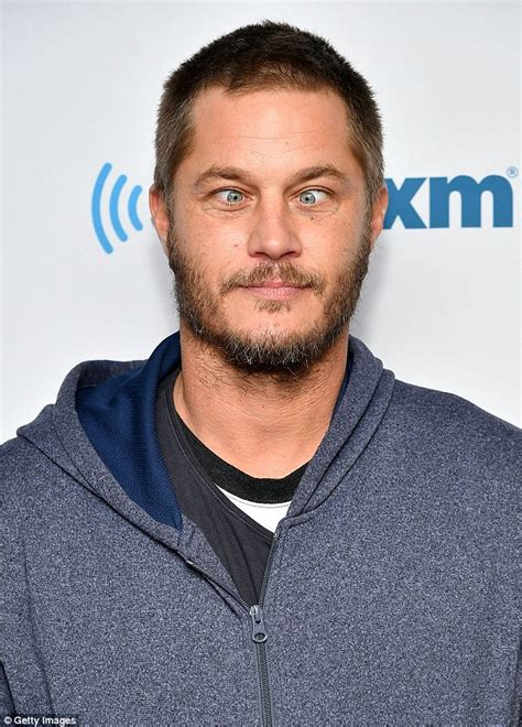 Travis Fimmel crosses eyes while posing for cameras as he arrives at ...