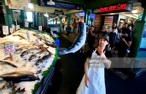 Tossing fish around is a tradition at the Pike Place Fish Market that ...