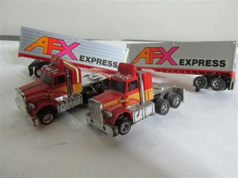 Rare HO Scale Semi trucks with trailers slot car