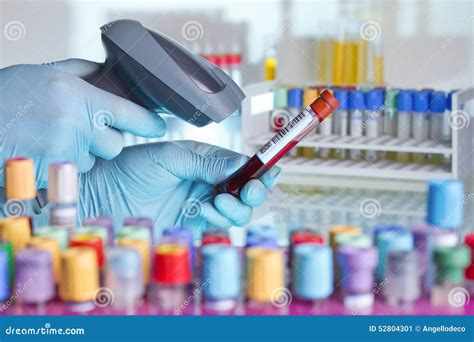 Hands Scanning A Tube With Barcode Label For Tracking Blood Samp Stock