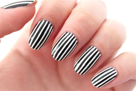 the beauty series | uk beauty blog: vertical black and white striped nails