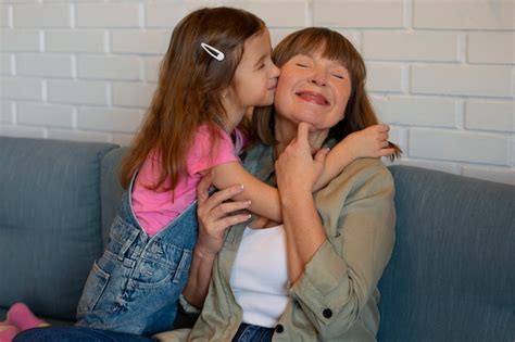 Free Photo Medium Shot Girl Kissing Granny