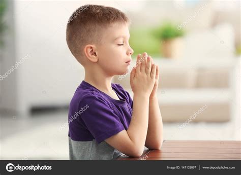Little Boy Praying Stock Photo By ©belchonock 147132867