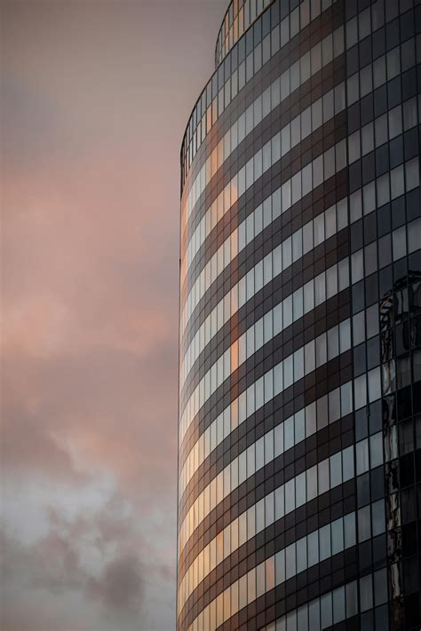 Corrugated Glass Facade Of A Modern Skyscraper · Free Stock Photo