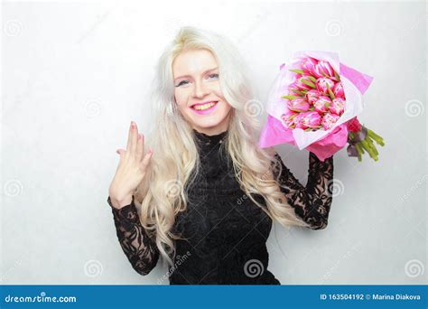 Tender Pretty Blonde Slim Teen Girl With Pink Flowers Cheerful Woman With Fresh Bouquet Stock