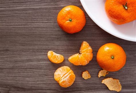 Premium Photo Fresh Mandarin Oranges Fruit Or Tangerines On A Wooden