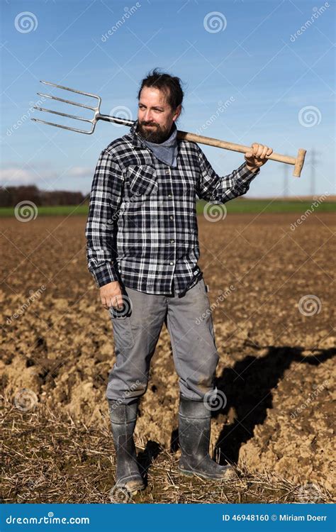 Portrait Of A European Farmer With A Pitchfork Stock Photo Image Of