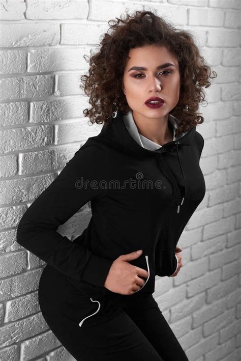 Curly Exotic Girl Posing Near White Wall Stock Photo Image Of Lothes