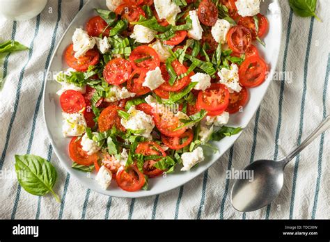 Homemade Caprese Salad With Mozarella Basil And Tomato Stock Photo Alamy