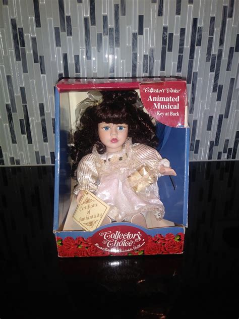 Dan Dee Collectors Choice Musical Fine Porcelain Doll With Cream Gold Dress And Black Hair