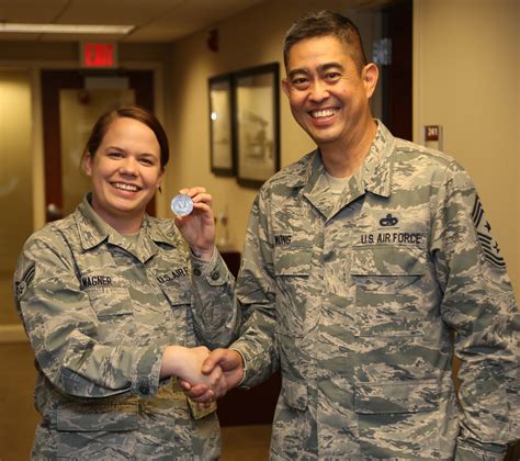 Airman Receives Coin For 932nd Aeromedical Evacuation Squadron Work