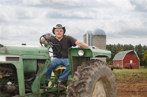 Farmer On Tractor — Stock Photo © Jamesgroup 13471193
