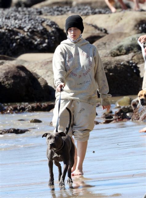 Billie Eilish Does Downtime Right As She Enjoys Playful Beach Walk With