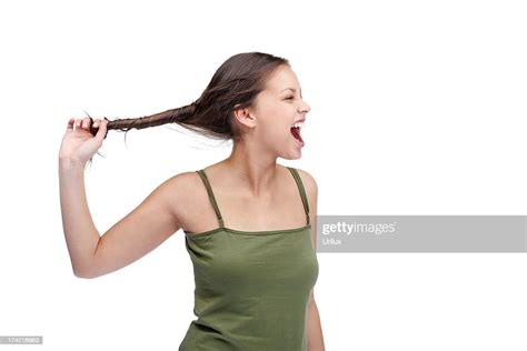 Frustrate Young Girl Pulling Her Hair On White High Res Stock Photo