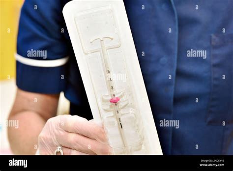 Contraceptive Coil Nurse Holding A Hormonal Intrauterine Device Iud