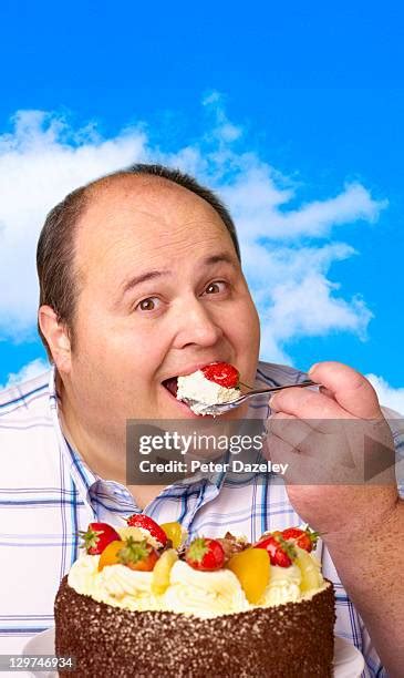 Fat Man Eating Cake Photos And Premium High Res Pictures Getty Images