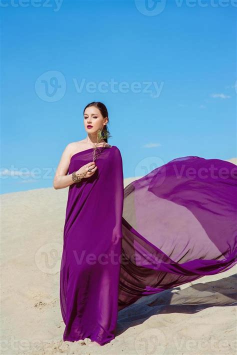 Amazing Beautiful Brunette Woman With The Peacock Feather In Purple