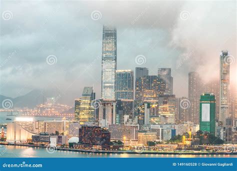 Kowloon Skyscrapers Night Skyline With Water Reflections Stock Photo