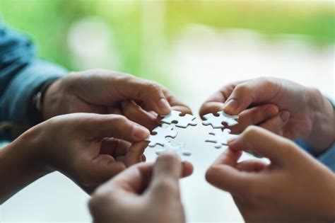 Premium Photo Closeup Image Of A Group Of People Holding And Putting