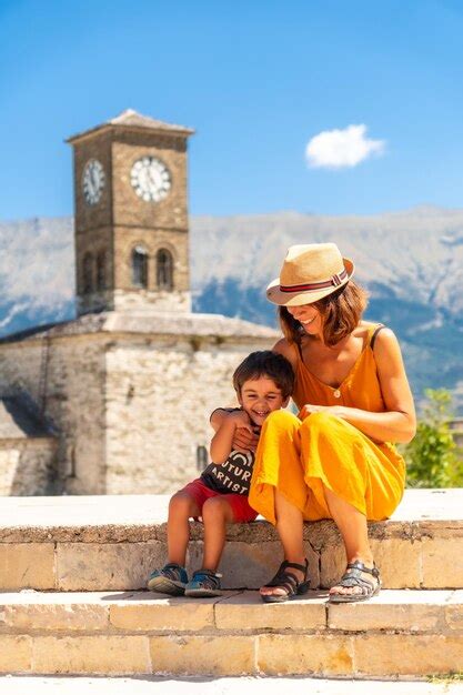 Premium Photo Mother And Son Having Fun At The Clock Tower In The