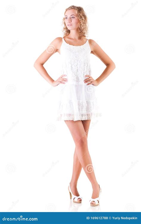 Young Slim Beautiful Blond Woman With Curly Hair In White Mini Dress