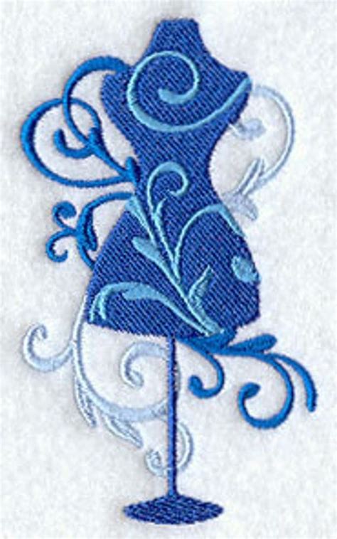 A Blue And White Embroidered Design With Swirls On Its Side In The