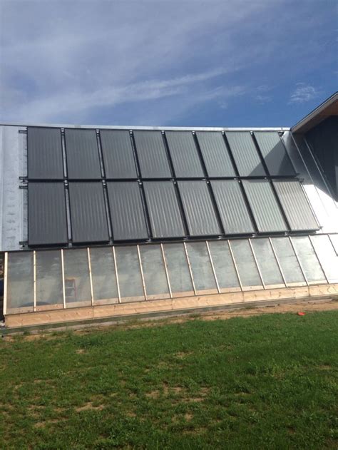 Solar Thermal Collectors Integrated Into Passive Solar Design And A Aquaponics Greenhouse