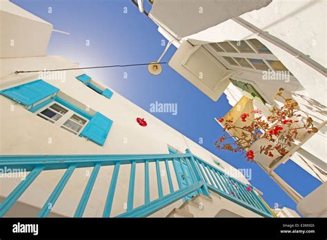 Typical White Wall With Blue Painting And Sunny Day In Mykonos Town