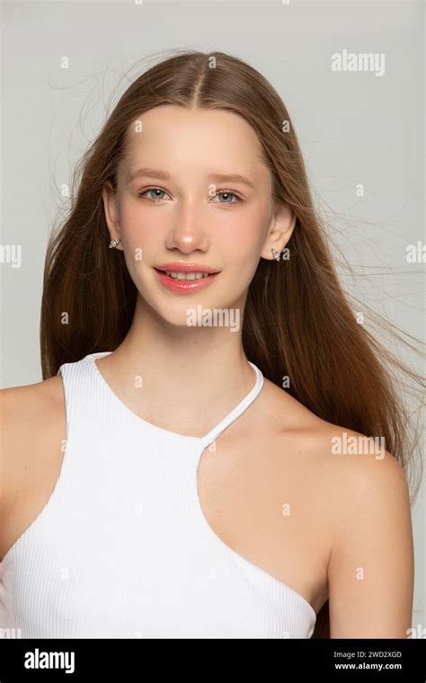 Portrait Of A Beautiful Blonde Girl With Blue Eyes And Clear Skin A Seventeen Year Old Girl