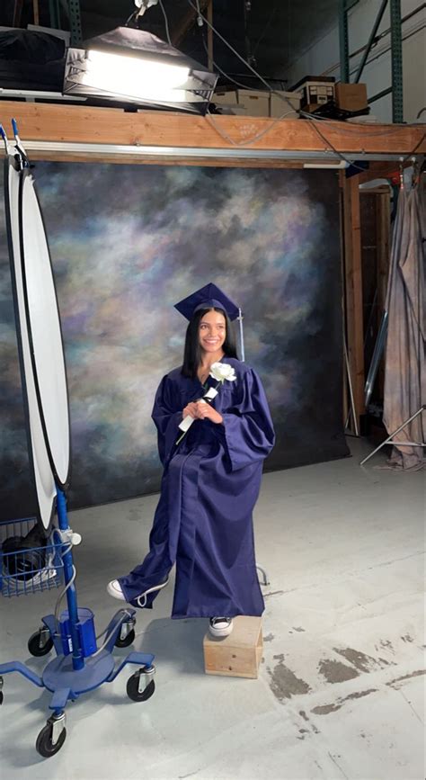 Graduation Portrait with Red Gown and Cap