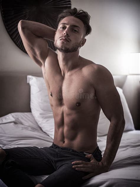 Shirtless Male Model Lying Alone On His Bed Stock Image Image Of Lone