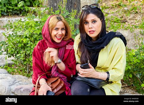 Tehran Iran April 28 2017 Two Iranian Girls In Hijabs Are Sitting