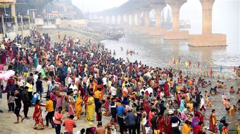 Patna Devotees Gather To Take A Holy Dip In The River Ganga On The