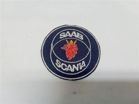 Se produkter som liknar Saab Scania Orginal Tygemblem på Tradera