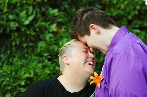 Premium Photo Happy Lesbian Couple Standing On Field At Park