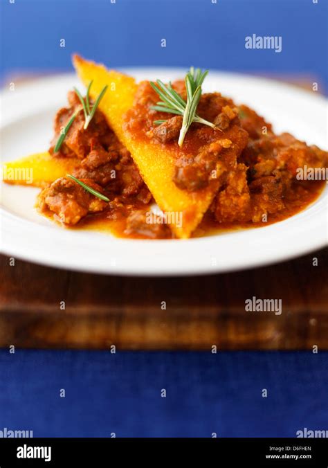 Instant Fried Polenta Served With Italian Sausage Ragu Stock Photo Alamy