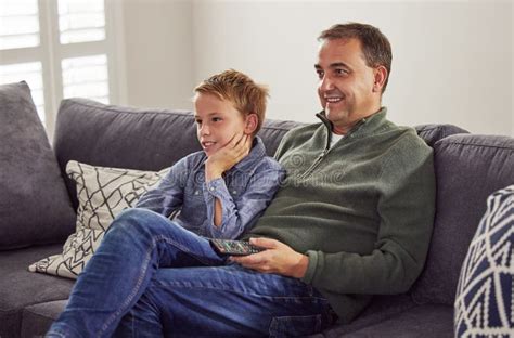 Catching Up On Our Favourite Shows A Handsome Mature Father Sitting