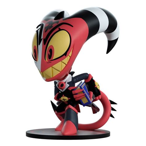 A Figurine Is Shown On A White Background With A Black And Red Design