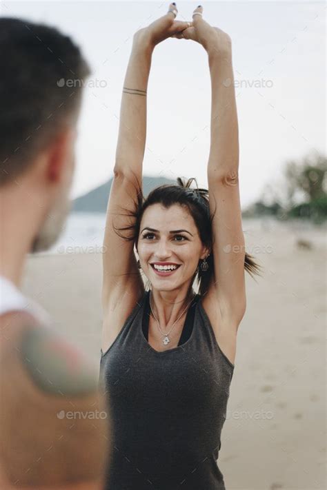 Couple Stretching At The Beach Stay Fit Beach Couples