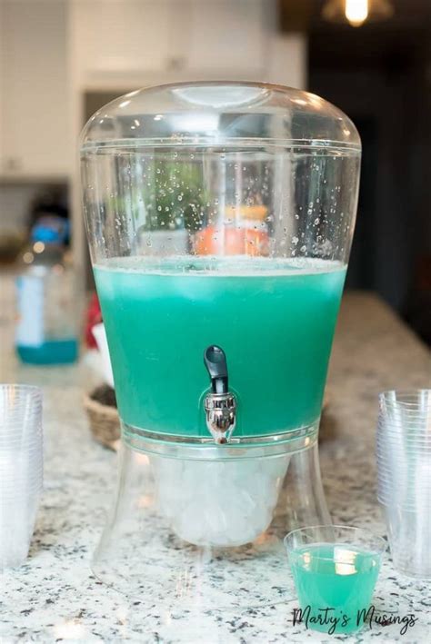 A Blue Liquid Is Being Used As A Dispenser