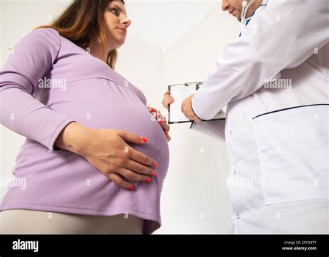 A Pregnant Woman Is Talking To A Doctor Psychologist The Concept Of