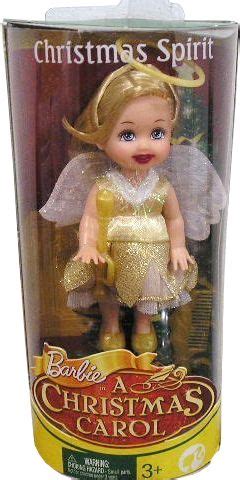 A Christmas Spirit Doll In A Box With Gold Dress And Angel Wings On It