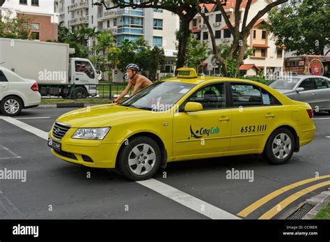 Yellow Taxi, Singapore Stock Photo - Alamy