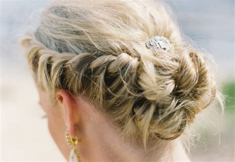 Regal wedding updo braided with rhinestone clip | OneWed.com