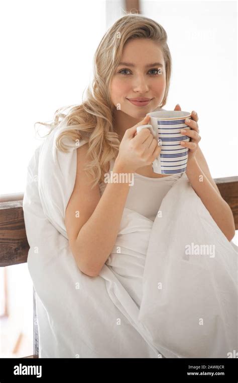 Positive Delighted Blonde Girl Enjoying Aroma Tea Stock Photo Alamy