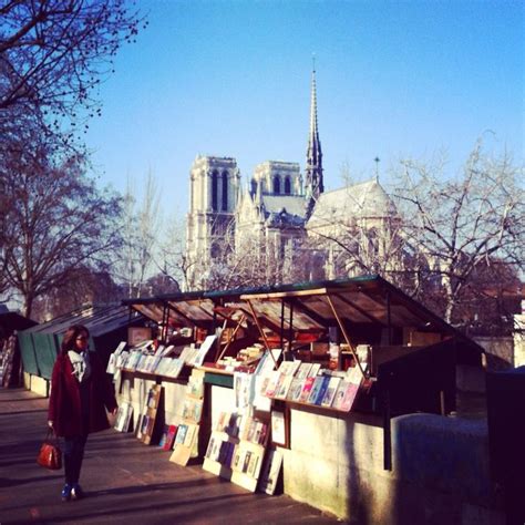 On The Bank Of River Seine With Book Sellers And Notre Dame Les