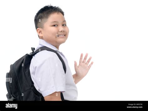 Asian Boy Student Going To School And Waving Goodbye Isolated On White