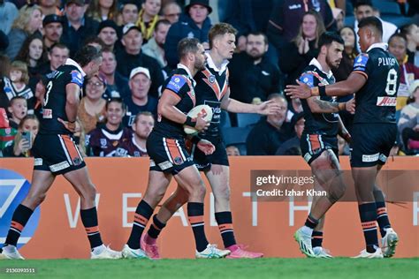 Charlie Staines Of The Wests Tigers Celebrates With His Team Mates