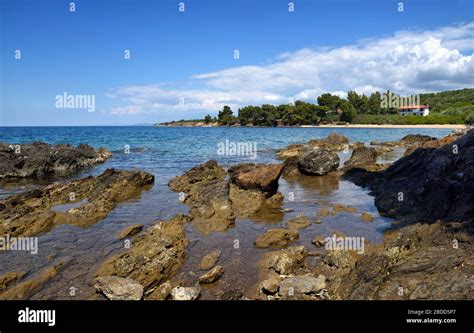 Beautiful Seascape With Stones And Translucent Blue Water Stock Photo